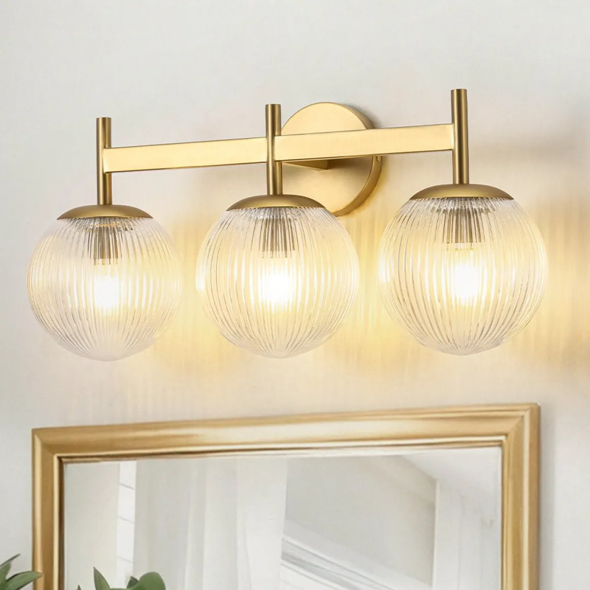 3-Light Brass Ribbed Glass Globe Vanity Wall Sconce