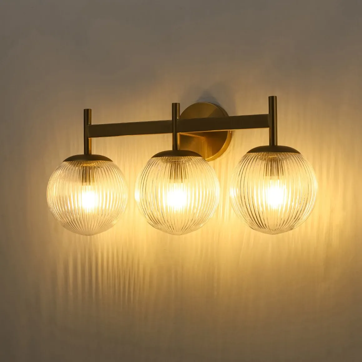 3-Light Brass Ribbed Glass Globe Vanity Wall Sconce
