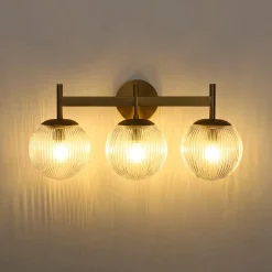 3-Light Brass Ribbed Glass Globe Vanity Wall Sconce