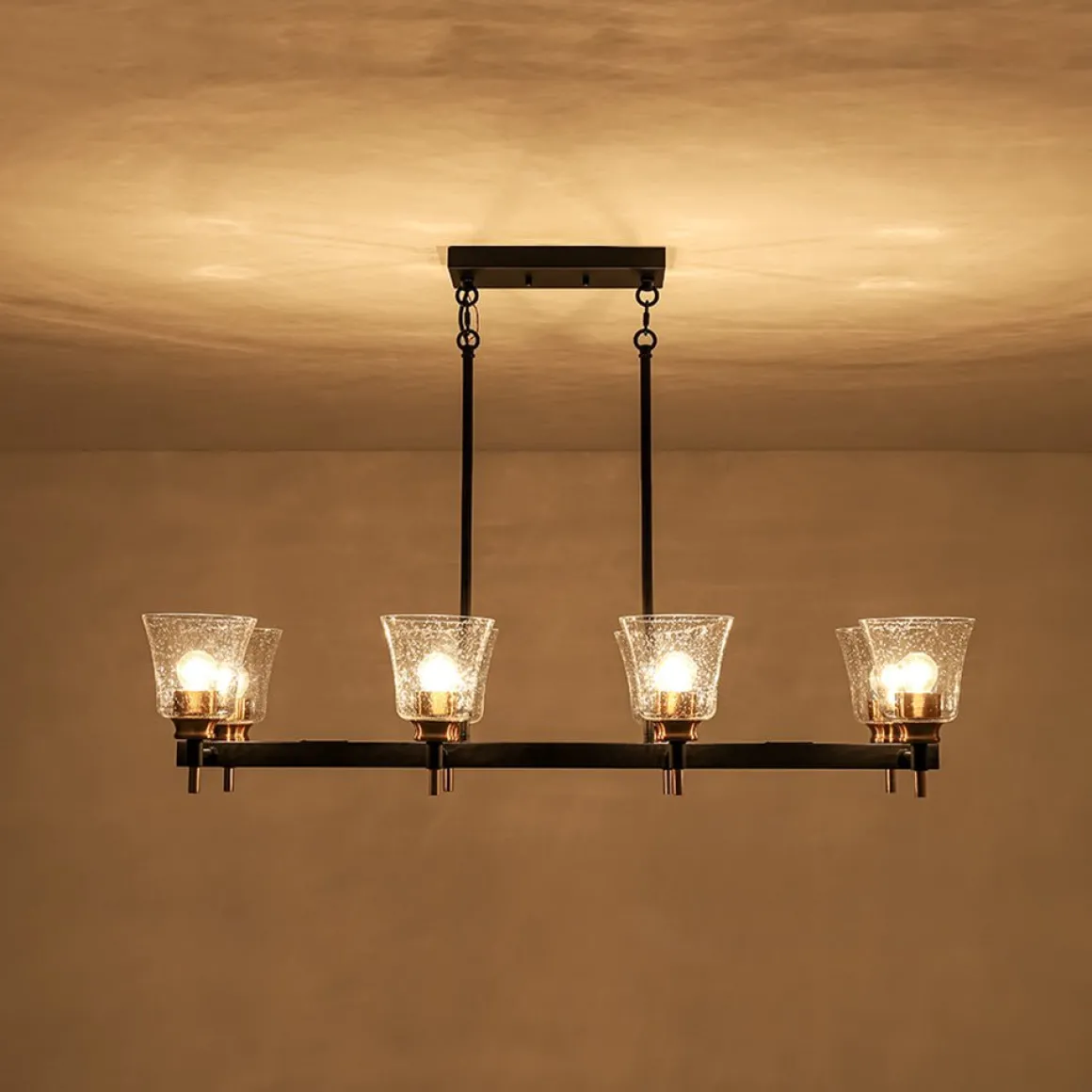 8-Light Seeded Glass Black Brass Linear Island Chandelier